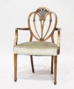 A GEORGIAN STYLE ARMCHAIR with padded seat.