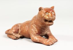 A JAPANESE CARVED WOOD TIGER. 5.5ins long.