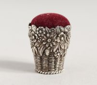 A SILVER BASKET PIN CUSHION.