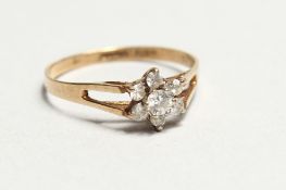 A 9ct GOLD AND DIAMOND RING.
