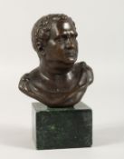 AFTER THE ANTIQUE A BRONZE ROMAN BUST on a marble base. 4ins high.