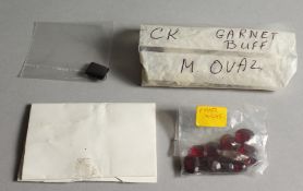 THREE BAGS OF GARNETS.