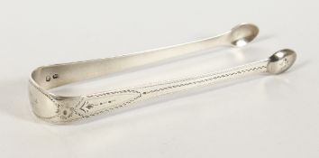 A PAIR OF GEORGIAN BRIGHT CUT SILVER SUGAR TONGS. Maker C. B.