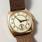 A 9CT GOLD CYMA WRISTWATCH with leather strap.