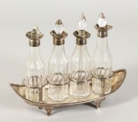 A GEORGE III SILVER BOAT SHAPED FOUR BOTTLE CRUET. London 1791.