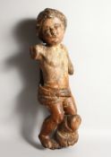 A 16TH-17TH CENTURY ITALIAN CARVED WOOD CHERUB. 23ins long. Arms Damaged.