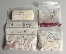 FOUR BAGS OF RUBIES.