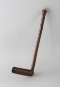A CARVED WOOD ZULU PIPE. 10.75ins long.