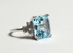 AN 18CT WHITE GOLD, BLUE TOPAZ AND DIAMOND RING. Topaz: 7.75cts. Diamonds: 0.33cts.