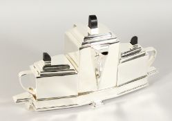 A CHRISTOPHER DRESSER DESIGN PLATE THREE PIECE TEA SET on a base.