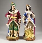 A LARGE PAIR OF PARIS PORCELAIN FIGURES OF A TURKISH MAN holding a sword and a young lady. 16ins