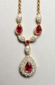 AN 18CT YELLOW GOLD, RUBY AND DIAMOND NECKLACE on chain. Rubies: 1.0cts. Diamonds: 0.3cts.