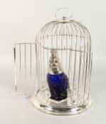 A GOOD LARGE SILVER PLATE BIRD CAGE with a blue parakeet jug and eight glasses. 18ins high.