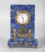 A SUPERB RUSSIAN FABERGE STYLE LAPIS AND SILVER CLOCK, with applied decoration, winged eagles and
