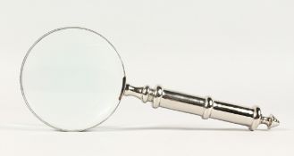 A MAGNIFYING GLASS with chrome handle.