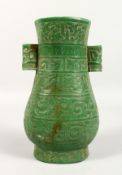A CHINESE GREEN STONE TWO-HANDLED VASE. 9.5ins high.