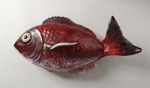A LARGE FISH TUREEN AND COVER. 20ins long.