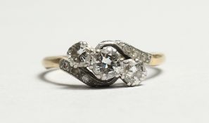 AN 18CT GOLD CROSSOVER RING.