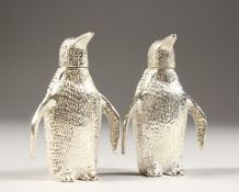 A PAIR OF SILVER PLATE PENGUIN SALT AND PEPPERS.