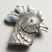 A CAST SILVER COCKEREL VESTA.
