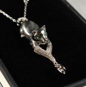 A SILVER CAT PENDANT AND CHAIN.