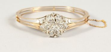 A GOOD GOLD AND DIAMOND SET CLUSTER BRACELET