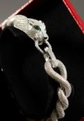 A CARTIER STYLE SILVER CABLE TWIST PANTHER BRACELET.