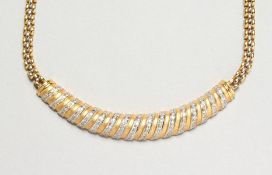 AN 18CT YELLOW GOLD AND DIAMOND SET PENDANT on an 18ct yellow gold chain. Diamond: 1.20cts. Gold: