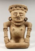 A COSTA RICAN CARVED STONE ANTIQUITY SEATED MAN. 14ins high.