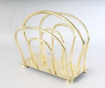 A GOOD BRASS MAGAZINE STAND on four bun feet. 15ins long.