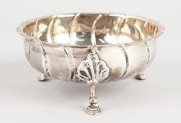 A VICTORIAN SILVER CIRCULAR SUGAR BOWL, 5ins diameter, wrythen fluted, on three pad feet. London