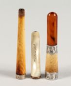 A SILVER BANDED CIGARETTE HOLDER and TWO OTHERS (3).
