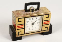 A GOOD CARTIER ART DECO CLOCK, No. 01328, black marble with brass and key pattern decoration. 2.5ins