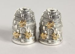 A PAIR OF .800 SILVER BEEHIVE SALT AND PEPPERS. 1.5ins high.