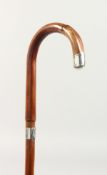 A WALKING STICK with silver tip and collar. Birmingham 1912. 2ft 9ins long.