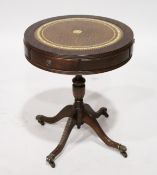 A GEORGIAN STYLE MAHOGANY CIRCULAR DRUM TABLE with leather top, on four legs. 1ft 8ins diameter.