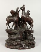 A GOOD BLACK FOREST CARVED WOOD GROUP, A FAMILY OF DEER. 18ins high.