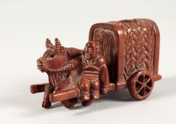 A SMALL JAPANESE CARVED WOOD GROUP, OXEN AND CART. Signed. 3.5ins long.