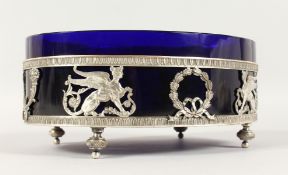A GOOD FRENCH SILVERED METAL OVAL STAND WITH SAPPHIRE GLASS LINER, the pierced sides with