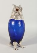 A GOOD BRISTOL BLUE GLASS OWL CLARET JUG with plate head and glass eyes. 12ins high.