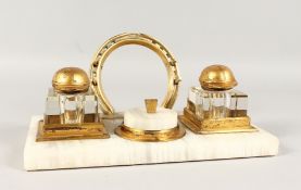 A GOOD ONYX EQUESTRIAN INKSTAND, with two glass inkwells with jockey cap, top and horseshoe. 10.5ins