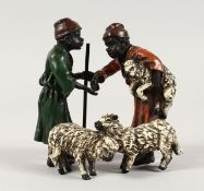 A GOOD AUSTRIAN PAINTED COLD CAST GROUP, young boys with lambs. 4ins high.