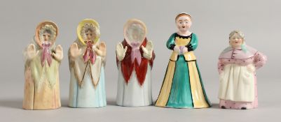 A RARE CROWN STAFFORDSHIRE CANDLE SNUFFER of a girl wearing a dress and a hat, three different