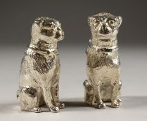 A PAIR OF SILVER PLATE DOG SALT AND PEPPERS.