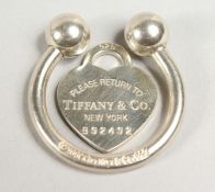 A TIFFANY & CO STERLING SILVER HORSESHOE KEYRING AND HEAD.
