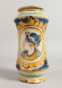 AN ITALIAN YELLOW AND BLUE GROUND DRUG JAR decorated with an oval head of a girl. 9.5ins high.