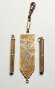 TWO GOLD CIGAR PRICKERS and A FLEXIBLE PENDANT. 30gms.