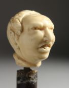 A 19TH CENTURY WALKING CANE, the handle carved as a MAN'S HEAD. 3ft long. Band Missing.