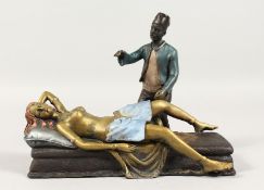 A COLD CAST GROUP, ARAB WITH A NUDE. 7.5ins long.