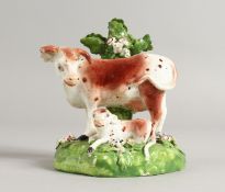 AN 18TH CENTURY DERBY COW AND CALF GROUP.